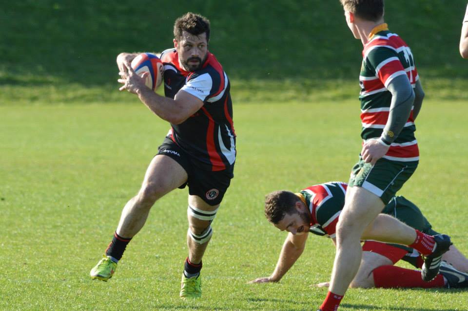 amateur rugby player from chesterfield running with ball in hand
