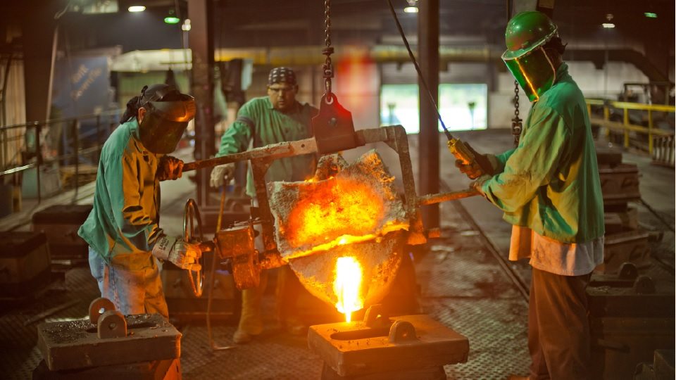 people working in a steel foundry 