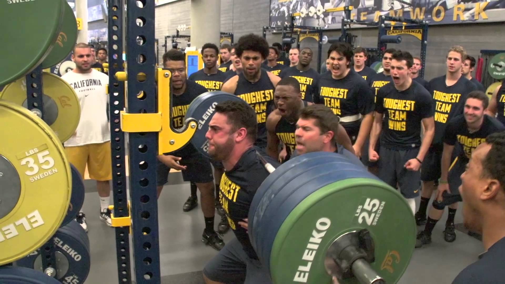 varsity college football players squat rack 