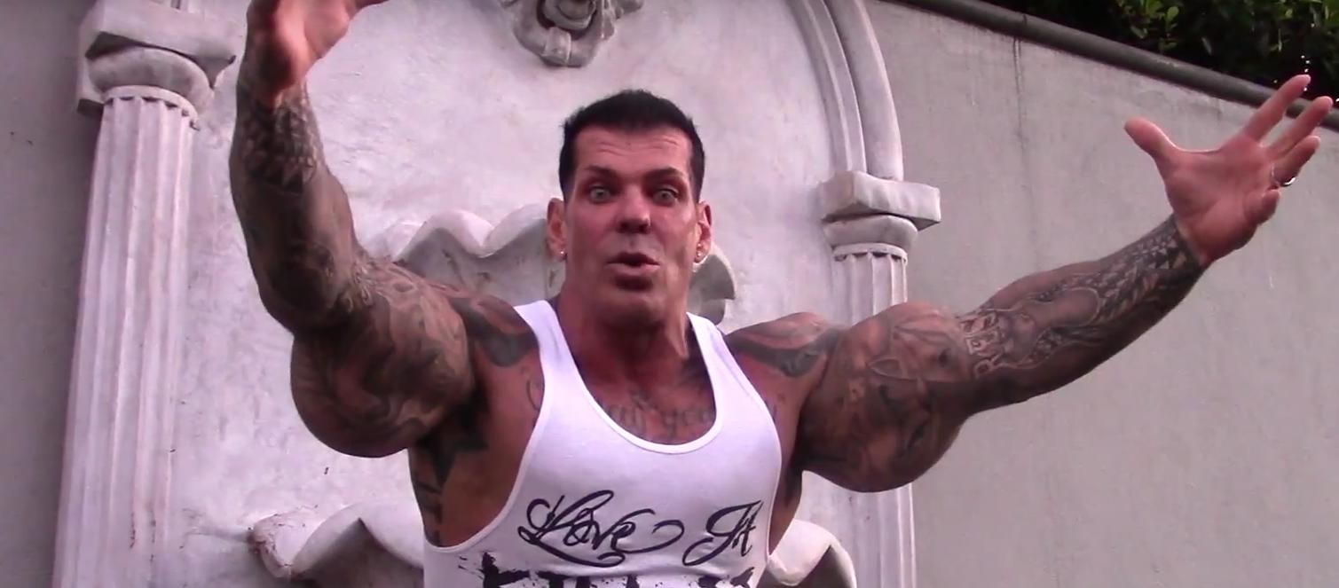 rich piana with his arms open wide and wide eyed expression