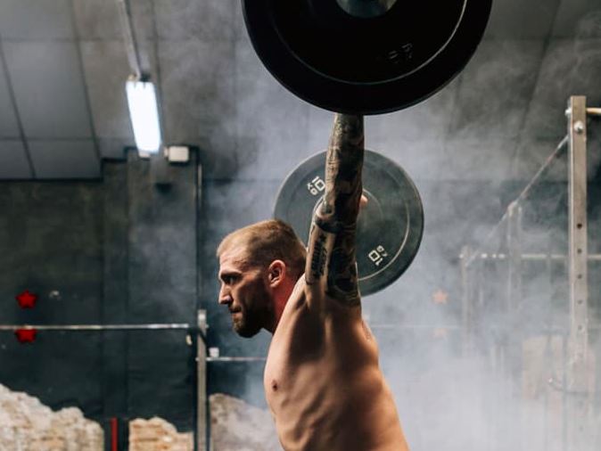 man lifting weights in a gym - can boron benefit?