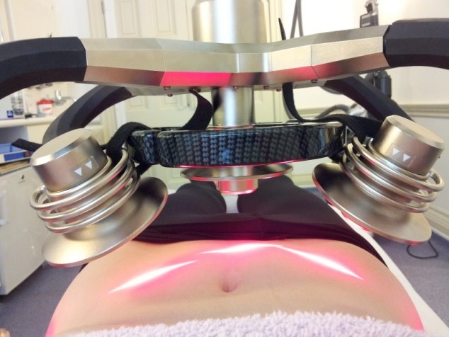 low level laser light therapy on a persons abdomen