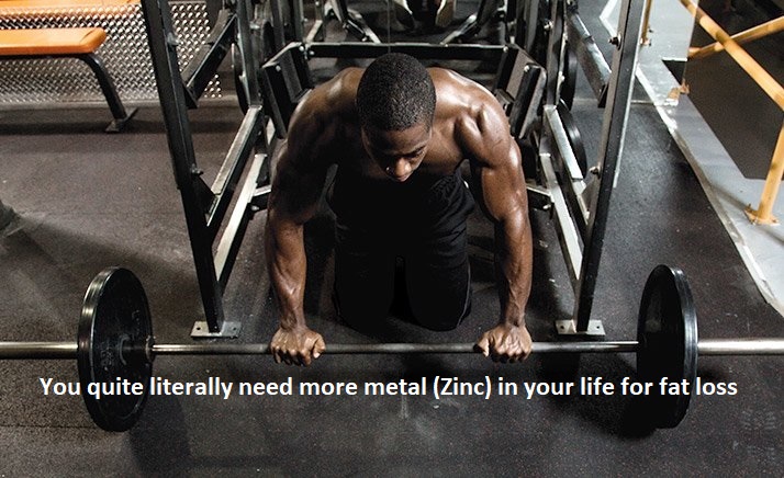 black man in a squat rack with a barbell