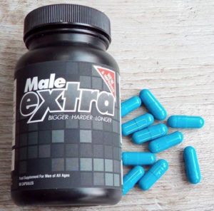 male extra bottle and pills